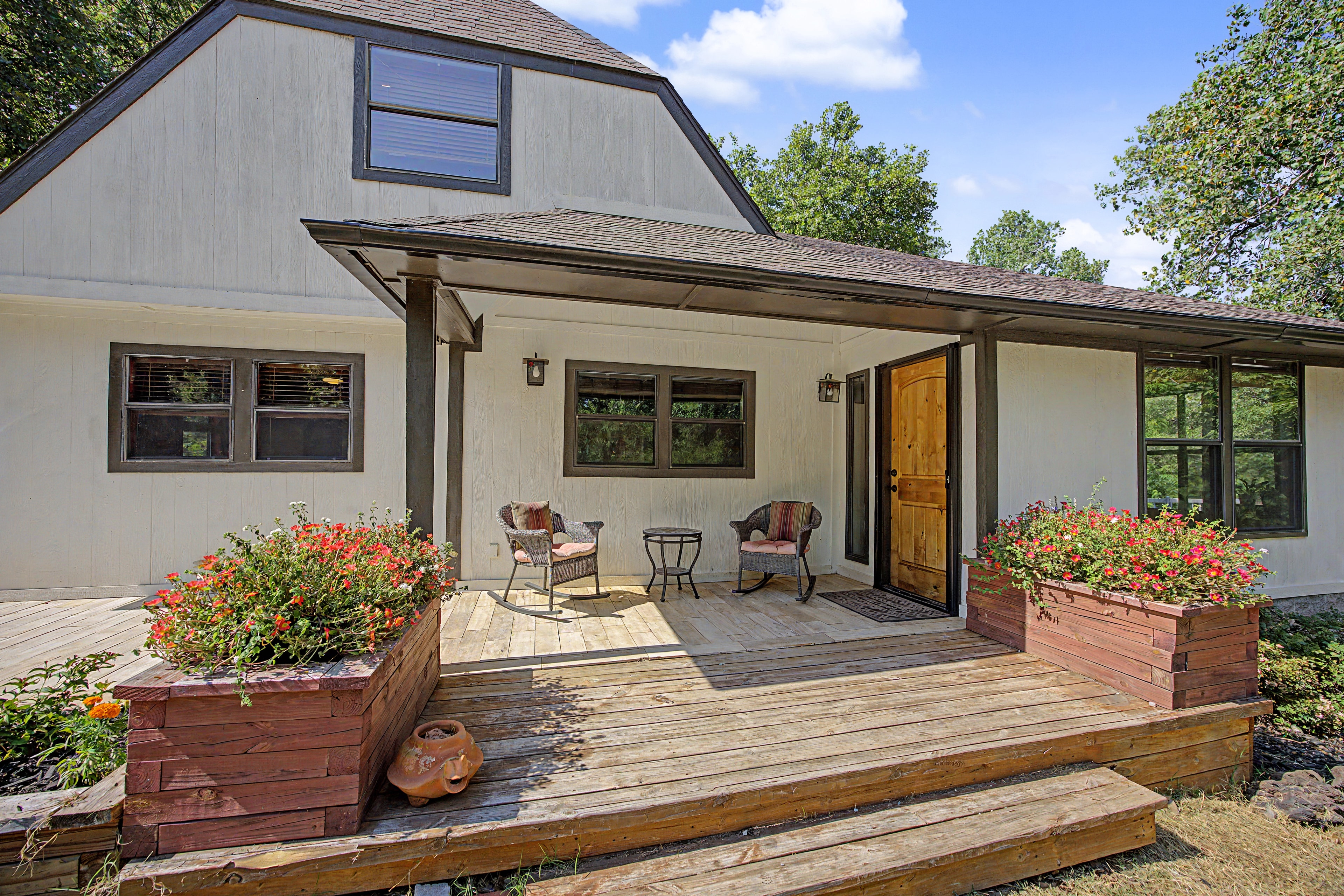 Modern farmhouse exterior with covered porch at 18805 SE 89th St